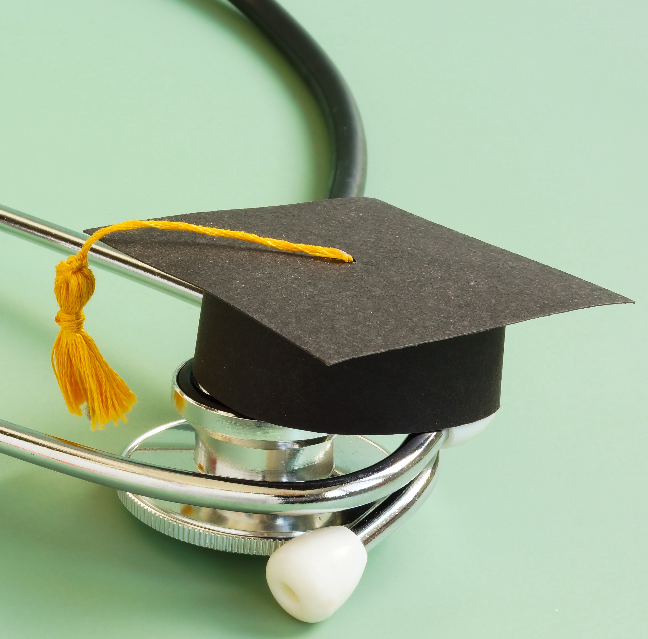 Medical education concept. Graduation cap and stethoscope.