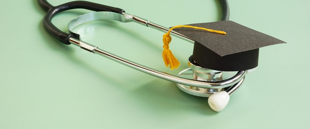 Medical education concept. Graduation cap and stethoscope.